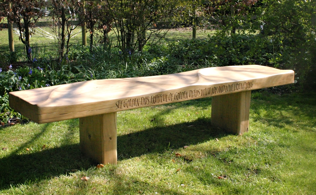 Martin Cooks beautifully sculpted oak kissing bench with a hand carved verse