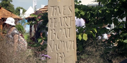 Hand carved York stone standing sundial - poem and carving by Martin Cook