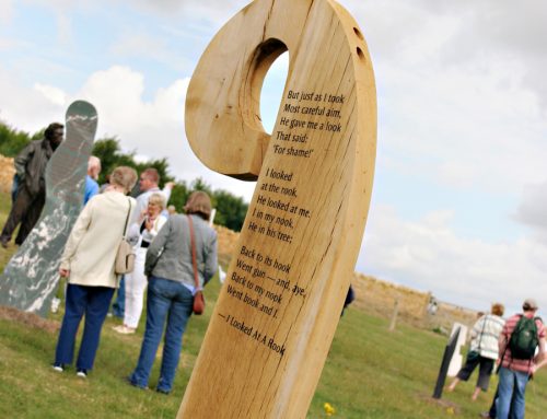 Oak standing stone lettered with poetry